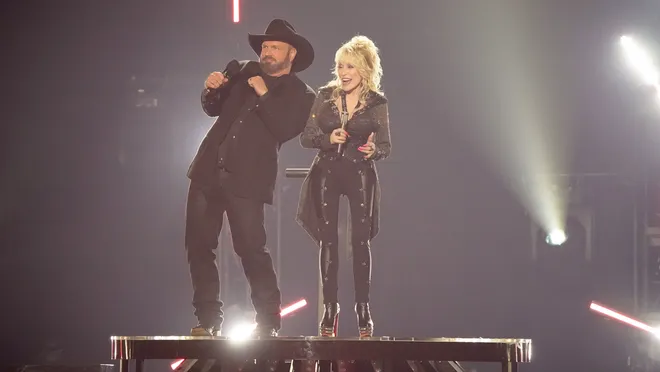 At the ACM Awards, Dolly Parton joked about a Garth Brooks trio while bringing a goat on stage. 