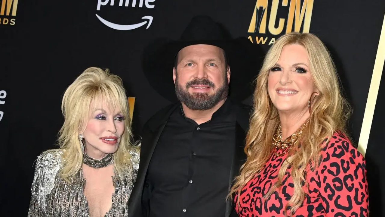 At the ACM Awards, Dolly Parton joked about a Garth Brooks trio while bringing a goat on stage.