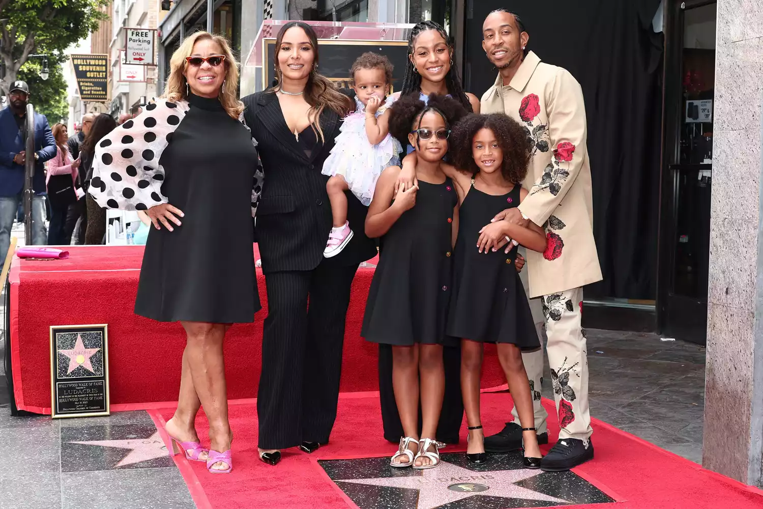 Ludacris beams as he receives a star on the Hollywood Walk of Fame alongside all four of his daughters. 